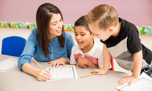 Teacher helping student